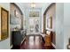 Elegant foyer features hardwood floors, arched doorways, and decorative details, creating a welcoming entrance at 8205 Prairie Ridge Way, Tampa, FL 33647