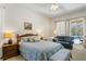 Inviting main bedroom with direct access to the outdoors and a cozy sitting area at 8205 Prairie Ridge Way, Tampa, FL 33647