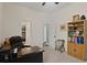 Office space with desk, chair, and built-in bookshelf, ideal for work or study at 8205 Prairie Ridge Way, Tampa, FL 33647