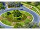 Beautifully landscaped cul-de-sac and community sign create a welcoming entrance at 8205 Prairie Ridge Way, Tampa, FL 33647