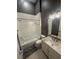 Well-lit bathroom features a shower-tub combo, marble countertop, and neutral color palette at 8503 Kentucky Derby Dr, Odessa, FL 33556