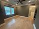 This empty bedroom features wood floors, crown molding, and a walk-in closet at 8503 Kentucky Derby Dr, Odessa, FL 33556