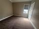 Bedroom with carpet flooring, window and trim at 8503 Kentucky Derby Dr, Odessa, FL 33556