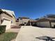 Spacious driveway showcasing multiple garages, perfect for car enthusiasts or extra storage at 8503 Kentucky Derby Dr, Odessa, FL 33556