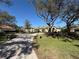 Beautiful home with meticulously maintained grounds and a grand driveway approach at 8503 Kentucky Derby Dr, Odessa, FL 33556