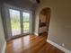 Living room featuring hardwood floors, double doors to the exterior, and a wet bar at 8503 Kentucky Derby Dr, Odessa, FL 33556