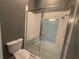 This bathroom features a tiled shower with a built-in seat and glass enclosure at 8503 Kentucky Derby Dr, Odessa, FL 33556