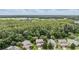 Neighborhood with well-maintained homes in a lush, green setting with mature trees and lake views at 19308 Sunset Bay Dr, Land O Lakes, FL 34638
