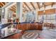 Lounge wet bar boasts dark wooden cabinetry, countertop space, and community seating at 19308 Sunset Bay Dr, Land O Lakes, FL 34638