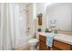 Well-lit bathroom with tub/shower combination and modern fixtures at 19308 Sunset Bay Dr, Land O Lakes, FL 34638