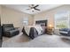 Comfortable bedroom showcasing a sleek gray bed with dual nightstands and a contemporary design at 19308 Sunset Bay Dr, Land O Lakes, FL 34638