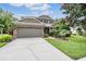 Well-maintained two-story home with a two-car garage, landscaping, and inviting curb appeal at 19308 Sunset Bay Dr, Land O Lakes, FL 34638