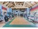 Community gym boasts various exercise machines, high ceilings, and large windows at 19308 Sunset Bay Dr, Land O Lakes, FL 34638