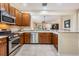Well-equipped kitchen featuring stainless steel appliances and a breakfast bar open to the living area at 19308 Sunset Bay Dr, Land O Lakes, FL 34638