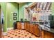 Community kitchenette features wooden cabinets, granite countertops, and stainless steel appliances at 19308 Sunset Bay Dr, Land O Lakes, FL 34638
