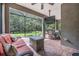 Outdoor living area with brick pavers, ceiling fan and fire table at 19308 Sunset Bay Dr, Land O Lakes, FL 34638
