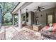 Covered and screened outdoor living area with patio furniture at 19308 Sunset Bay Dr, Land O Lakes, FL 34638