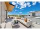 Spacious outdoor patio featuring stylish seating, modern decor, and a beautiful view of the surrounding area at 2 Aqua Reserve Blvd, New Port Richey, FL 34652