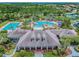 Community clubhouse with pools, lounge areas, and lush landscaping at 20312 Heritage Point Dr, Tampa, FL 33647