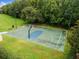 Well-maintained basketball court surrounded by trees, located within the community at 20312 Heritage Point Dr, Tampa, FL 33647
