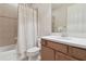 Bathroom with decorative tile and wood vanity provides a soothing color palette and functional space for daily routines at 20312 Heritage Point Dr, Tampa, FL 33647
