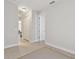 Hallway featuring tiled flooring and multiple doors adds architectural detail and flows throughout living spaces for style at 20312 Heritage Point Dr, Tampa, FL 33647