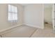 Tiled bedroom leads to tiled hall offering a transition with style, durability, and easy maintenance for relaxed living at 20312 Heritage Point Dr, Tampa, FL 33647