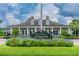 Beautiful Grand Hampton Clubhouse featuring well-manicured landscaping and inviting architecture at 20312 Heritage Point Dr, Tampa, FL 33647