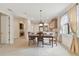Bright dining room with view into the kitchen and living room at 20312 Heritage Point Dr, Tampa, FL 33647