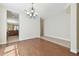 Dining area featuring hardwood floors, a chandelier, and access to the kitchen at 20312 Heritage Point Dr, Tampa, FL 33647