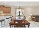 Elegant dining room with view into the kitchen and living room at 20312 Heritage Point Dr, Tampa, FL 33647
