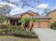 Charming single-story home with a well-manicured front yard and a two-car garage at 20312 Heritage Point Dr, Tampa, FL 33647
