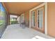 Covered lanai featuring comfortable seating and views of the surrounding landscape at 20312 Heritage Point Dr, Tampa, FL 33647