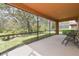 Spacious screened lanai with outdoor seating area and views of the lush landscaping at 20312 Heritage Point Dr, Tampa, FL 33647
