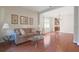 Living room with hardwood floors, neutral walls, and a view of the kitchen area at 20312 Heritage Point Dr, Tampa, FL 33647