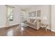 Inviting living room with hardwood floors, soft lighting, and a comfortable sofa at 20312 Heritage Point Dr, Tampa, FL 33647