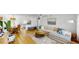Bright and airy living room features an open floor plan with modern decor and hardwood floors at 50 154Th Ave # 50, Madeira Beach, FL 33708