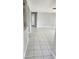 Bright living room featuring neutral walls and tile flooring at 5507 Riddle Rd, Holiday, FL 34690