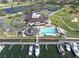 Aerial view featuring the clubhouse, pool, marina and other community recreational facilities at 5836 Skimmer Point S Blvd, Gulfport, FL 33707