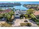 Aerial view of a charming coastal home in a waterfront community, enhanced by lush landscaping and a beautiful inter coastal at 5836 Skimmer Point S Blvd, Gulfport, FL 33707