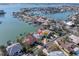 An aerial view shows the canal-front property with private boat dock and surrounding neighborhood at 5836 Skimmer Point S Blvd, Gulfport, FL 33707