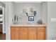 Dry bar features built in shelves and cabinets with granite countertops at 5836 Skimmer Point S Blvd, Gulfport, FL 33707
