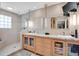 Bright bathroom with double sinks, glass shower, granite counters, and modern fixtures for a spa-like feel at 5836 Skimmer Point S Blvd, Gulfport, FL 33707
