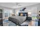 Serene bedroom with ceiling fan, accent wall art, and sliding glass doors at 5836 Skimmer Point S Blvd, Gulfport, FL 33707