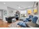 Comfortable game room with a pinball machine and blue leather recliners at 5836 Skimmer Point S Blvd, Gulfport, FL 33707