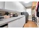 Well-equipped laundry room with modern appliances, ample counter space, and storage cabinets for convenience at 5836 Skimmer Point S Blvd, Gulfport, FL 33707