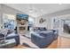 Inviting living room features vaulted ceilings, fireplace, and a waterfront view at 5836 Skimmer Point S Blvd, Gulfport, FL 33707