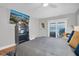 Cozy main bedroom with waterfront view and sliding door access to the balcony at 5836 Skimmer Point S Blvd, Gulfport, FL 33707