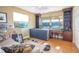 Bright office provides water views, built-in shelving, and ample workspace for productive work from home at 5836 Skimmer Point S Blvd, Gulfport, FL 33707