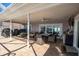 Relax on this covered patio with comfortable seating, a dining area, and views of the waterfront at 5836 Skimmer Point S Blvd, Gulfport, FL 33707